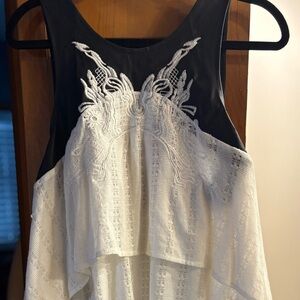 Black faux leather and White Lace tunic. 
Back details are amazing!